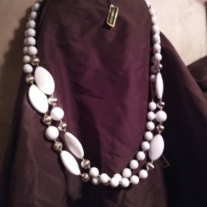 12 strands of Lucite beads or necklaces.